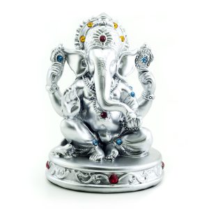 Gilded figure of the elephant Ganesha on white background